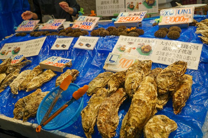 Kuromon Market Food Walking Tour in Osaka (6 stops, 6 tastes) - Namba, comedy, and Dotonbori context