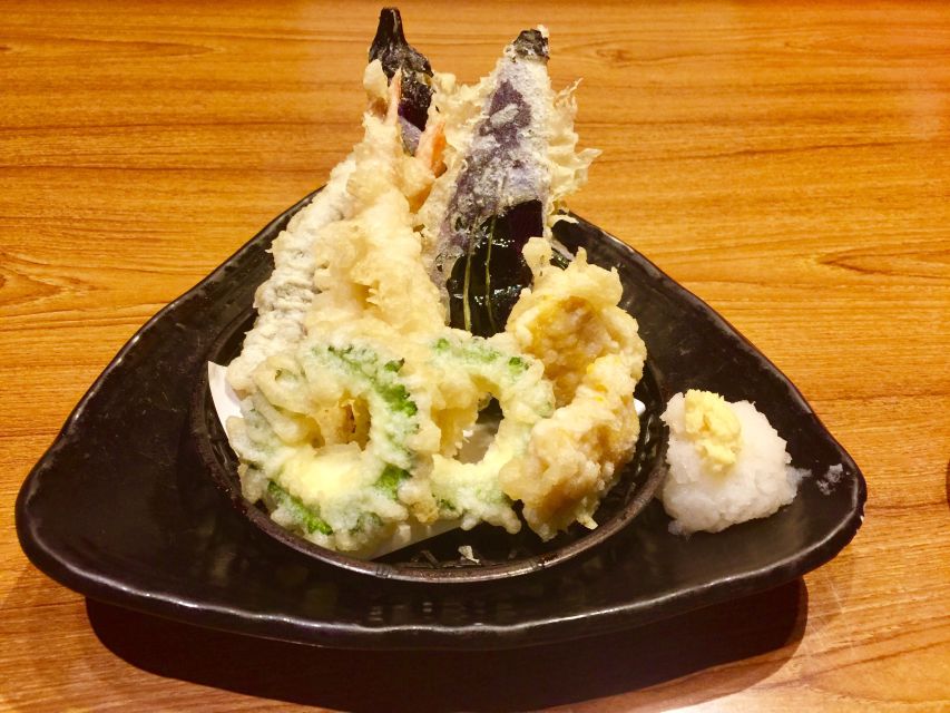Osaka: Food Tour at Night with Tastings - The former hotel turned into a bar collection