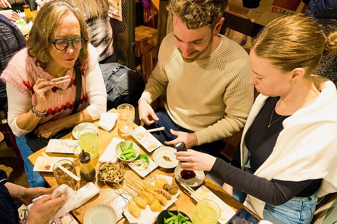 Osaka: Guided Food Tour with 12 Dishes at 4 Local Eateries - Fresh fish, grilled skewers, and the changing menu