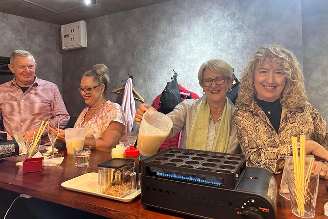 Osaka Sake Tasting & Takoyaki Cooking Experience - Eating the food with your chosen sake