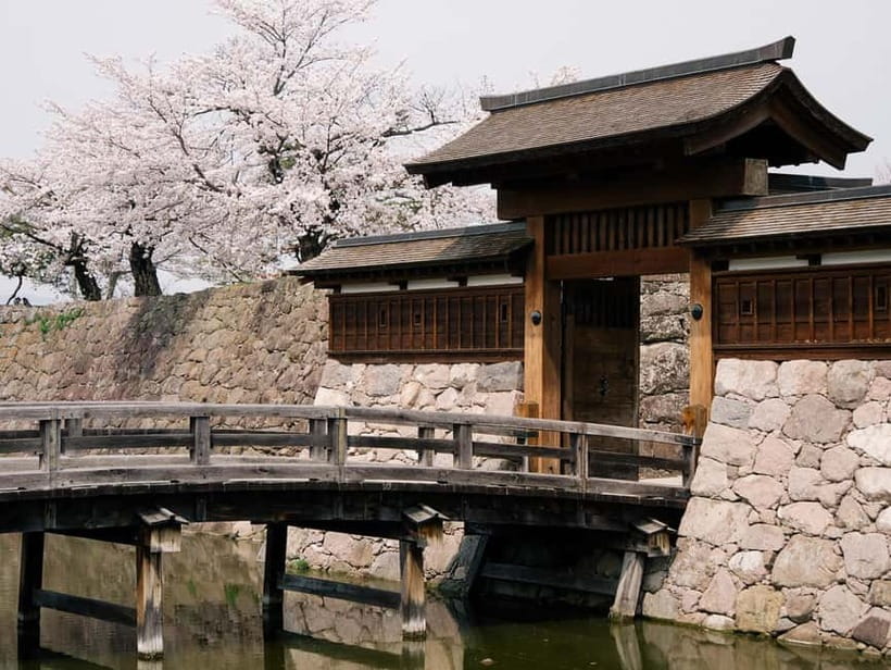 Tokyo: Nagano Snow Monkeys and Zenkoji Tour with Temples - Matsushiro Castle Ruins add a samurai-era pause
