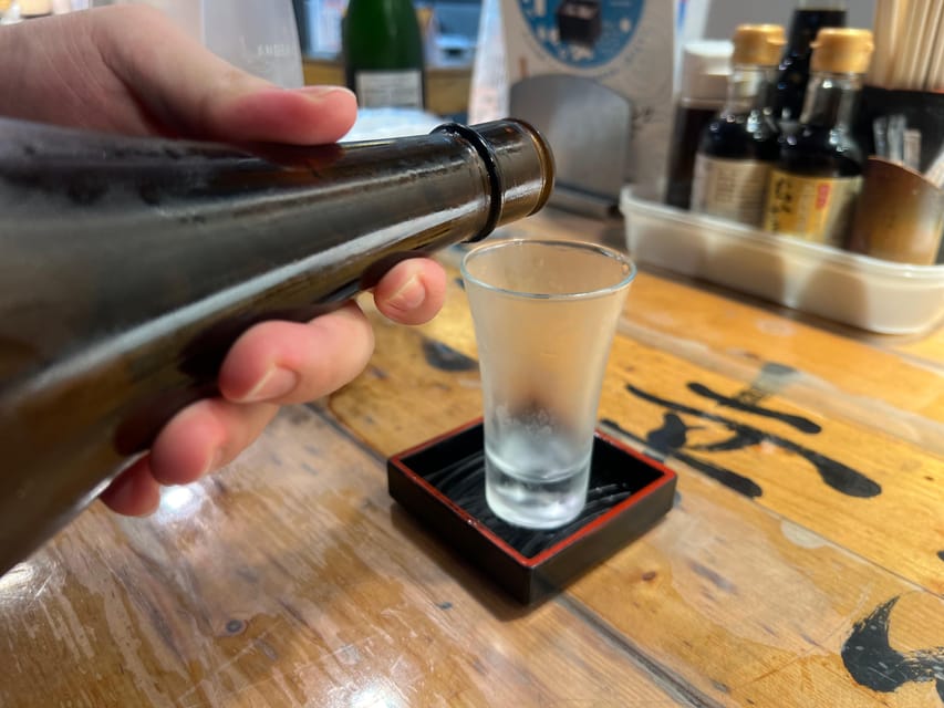 Tokyo: Shinjuku Food Tour (15 Dishes and 4 Eateries) - Meeting at the blue AOKI sign