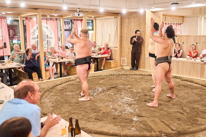 TokyoSumoShow, ChickenHotPot, and Mochi-Pounding by Pro Wrestlers - The sumo challenge is the big crowd moment