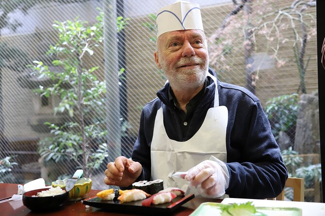 Tsukiji Fish Market Guided Tour and Sushi Making with Pro Chef - The sushi lesson in a traditional building